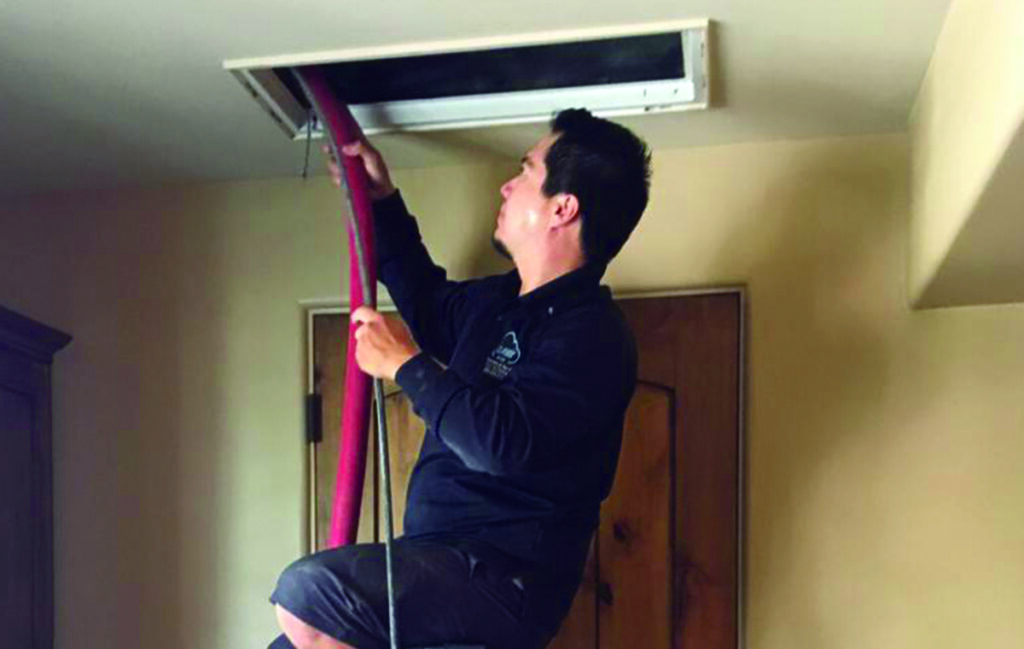 air duct cleaning technician in mesa, az cleaning air duct vent at a customer's house in mesa, arizona air duct cleaning technician in mesa, az cleaning air duct vent at a customer's house in mesa, arizona